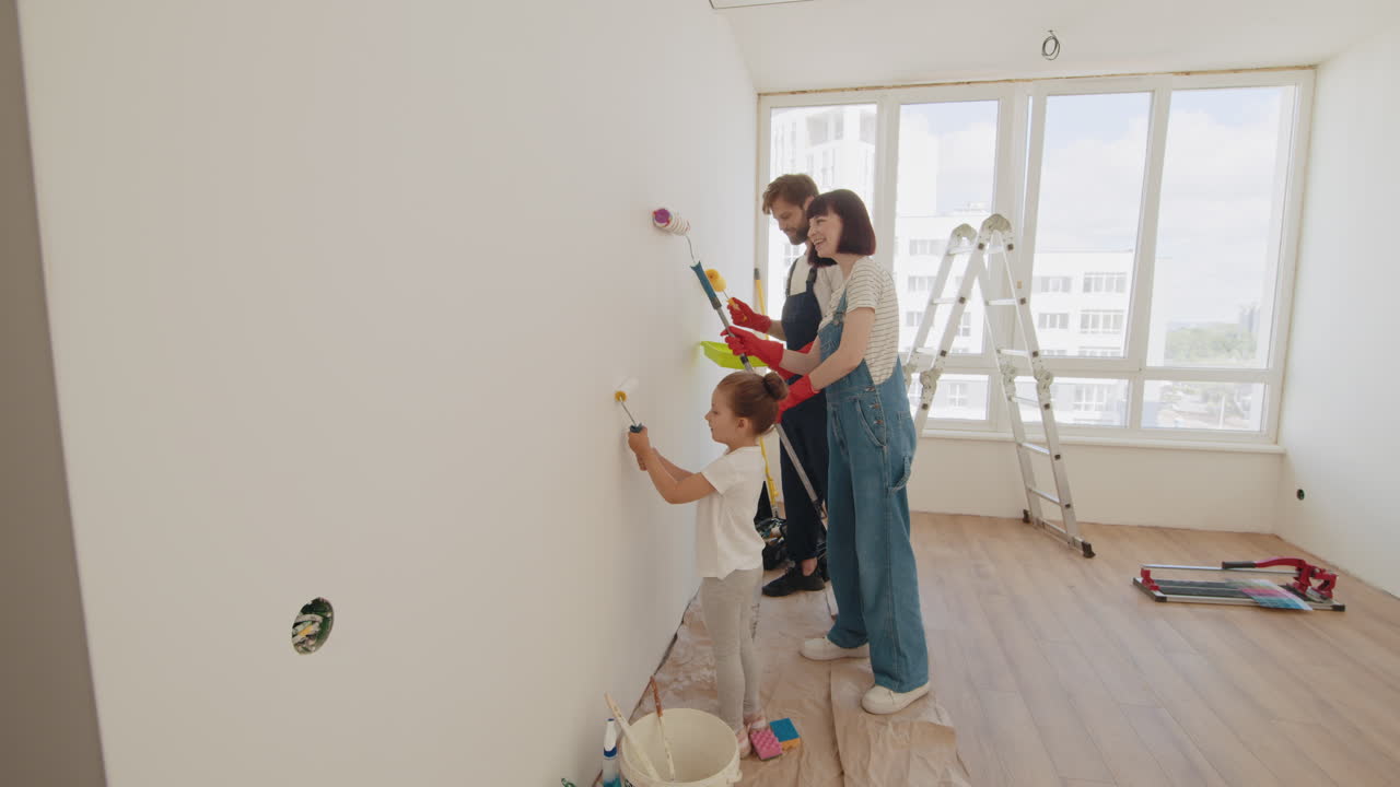 Family Painting a Wall Together