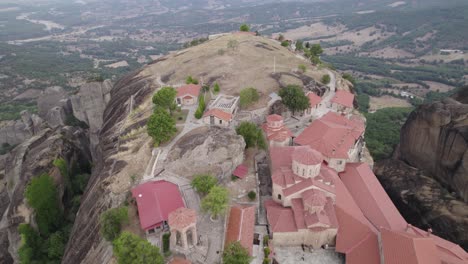 Topdown-Along-the-Holy-Monastery-Of-Great-Meteoron-revealing-Breathtaking-Rocky-landscape,-Greece