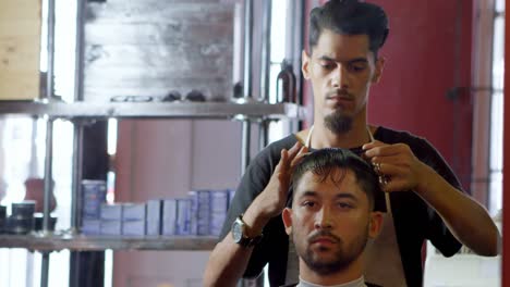 Barber-trimming-clients-hair-4k