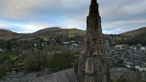 Aerial-footage-of-Ambleside-the-Lakeland-town-and-former-civil-parish,-now-in-the-parish-of-Lakes,-in-Cumbria,-in-North-West-England-2023