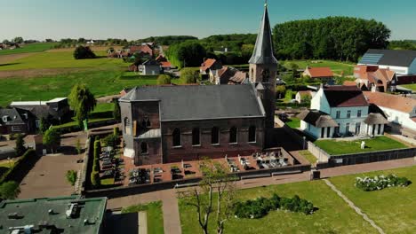 Drone-shot-of-a-church-in-flanders,-belgium