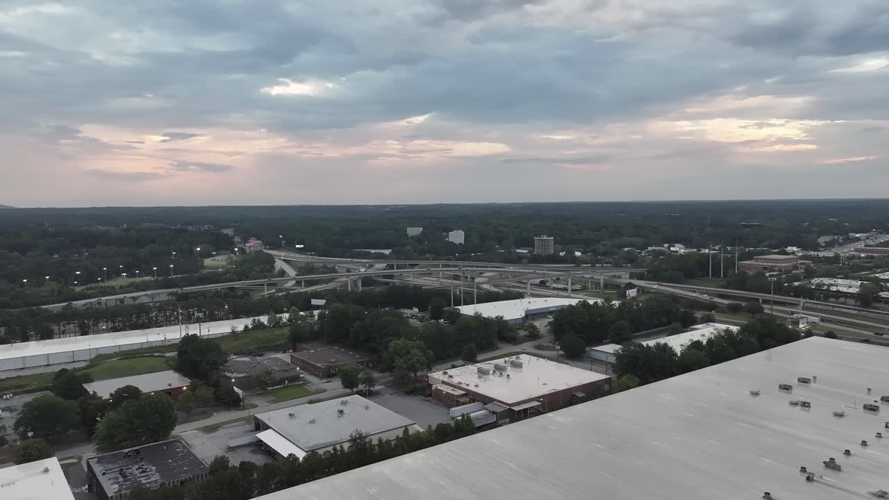 Industrial warehouses near highway, freeway, expressway in Atlanta Georgia, Spaghetti Junction corridor, Panoramic drone view