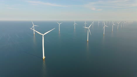 huge windmill turbines, offshore windmill farm in the ocean westermeerwind park , windmills isolated at sea on a beautiful bright day netherlands flevoland noordoostpolder