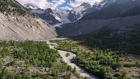 a drone advances over the morteratsch glacier, providing spectacular views of the glacier and the surrounding mountains