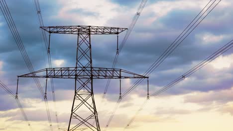 upward-shot-of-a-pole-with-power-lines-against-a-cloudy-sky