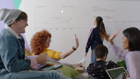 young-group-of-students-celebrating-asian-team-leader-woman-dancing-funny-enjoying-victory-dance-friends-celebrate-successful-teamwork-in-happy-colorful-office-presentation