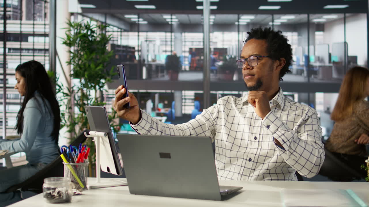 Office Environment with People Working on Laptops