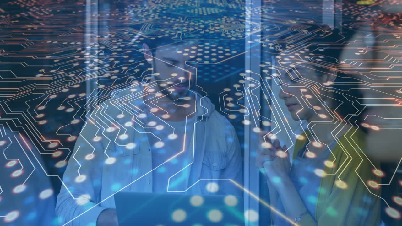 Man opening laptop as woman leaning in, circuit animating glowing nodes across experts in tech