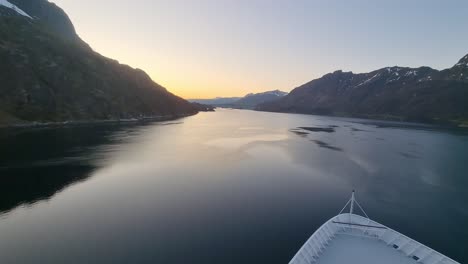 the view from the deck of a cruise ship sailing along the coast of norwaythe view from the deck of a cruise ship sailing along the coast of norway