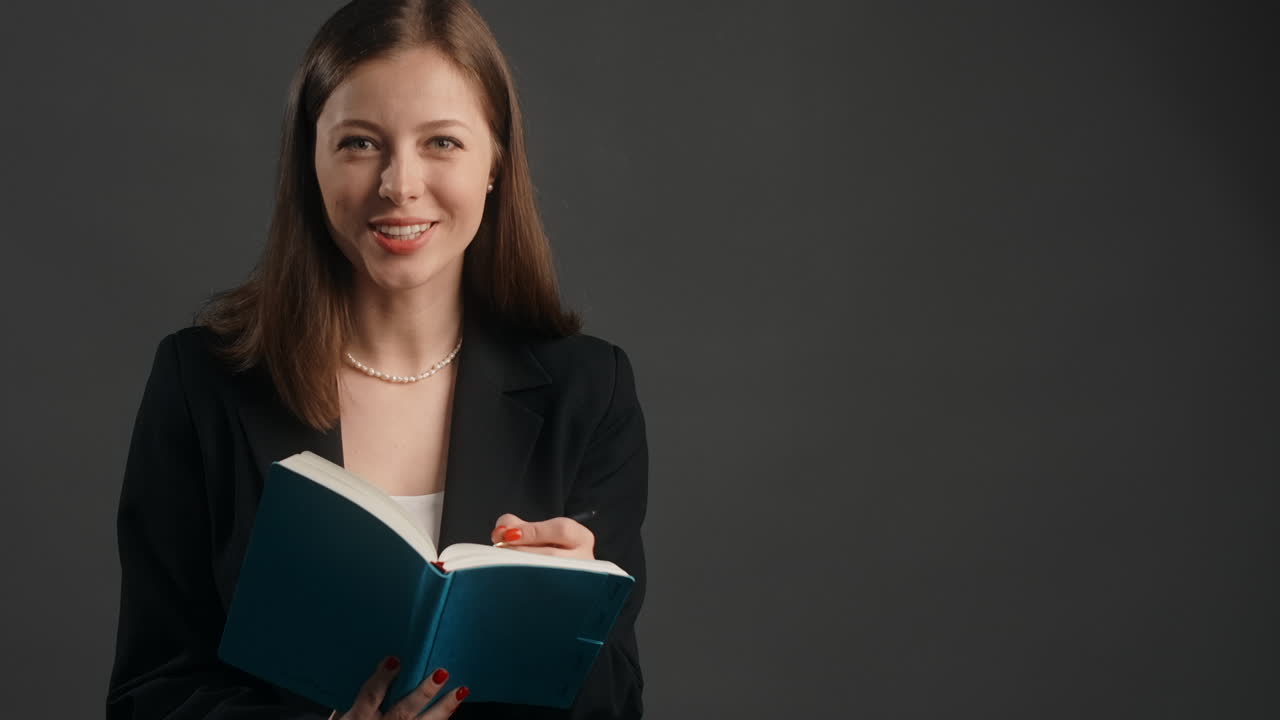 Woman Reading and Taking Notes