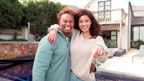 happy couple with house keys