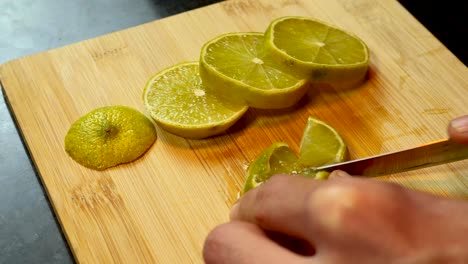 Cutting a lime in pieces shot on 4k