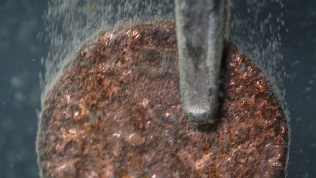 Electrolytic cleaning of ancient Roman coin seen in timelapse