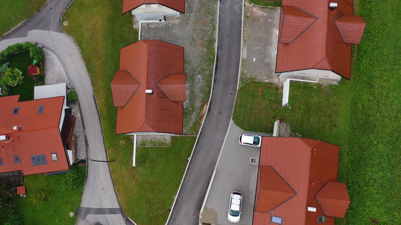 Drone aerial ascending bird eye view of small village cluster of houses