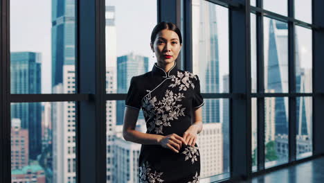 elegant woman in traditional chinese dress against a city skyline