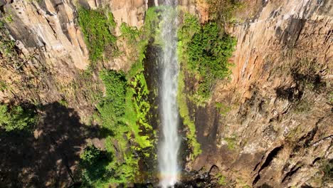 slow motion waterfall at scenic gorge canyon. peaking waterfall landscape. nature background. waterfalls cascade at gorge canyons background.  geologycal formation ecosystem. waterfalls landscape