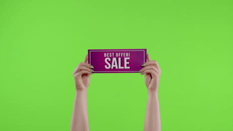 Best-Offer-Sale-advertisement-inscription-on-paper-sheet-in-womans-hands-on-chroma-key.-Slow-motion