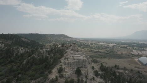 Aerial-descent-through-wildfire-smoke-above-Pulpit-Rock-and-Colorado-Springs