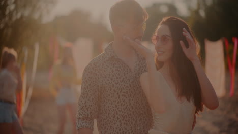 Happy-man-looking-at-girlfriend-grooving-to-music