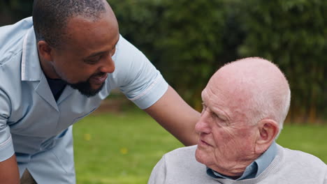 caregiver assisting elderly man
