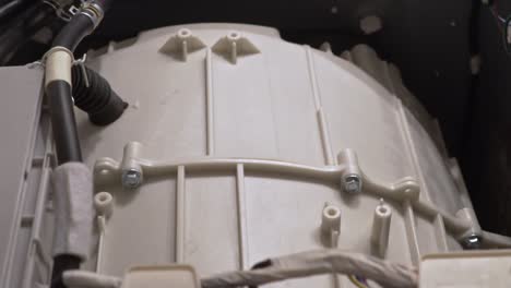 Close up at the interior mechanism of washing machine while it&#039;s working Slow motion 100fps