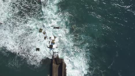 Aerial-view-of-the-waves-destruction-on-the-deactivated-marina-of-Lugar-de-Baixo,-Ponta-do-sol,-Madeira-Ísland,-Portugal