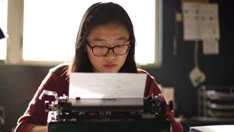a focused young writer engages with a vintage typewriter, crafting her thoughts on paper in a bright, creative workspace emphasizing authentic expression and reflection