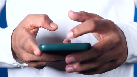 person using a dark green smartphone