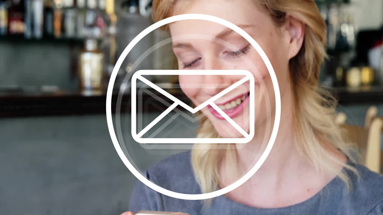 Using smartphone with email animation, smiling woman sitting in cafe