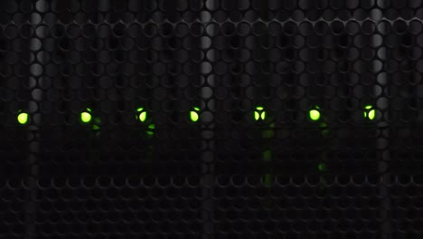 vertical video of flashlight shining in dark server room over data storage with flashing green led lights