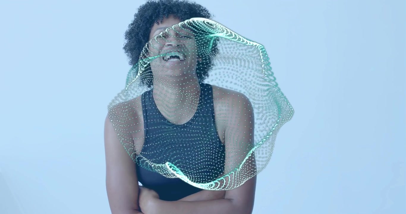 Woman brushing pulsing orb materializing, laughing while being enveloped, showcasing technology