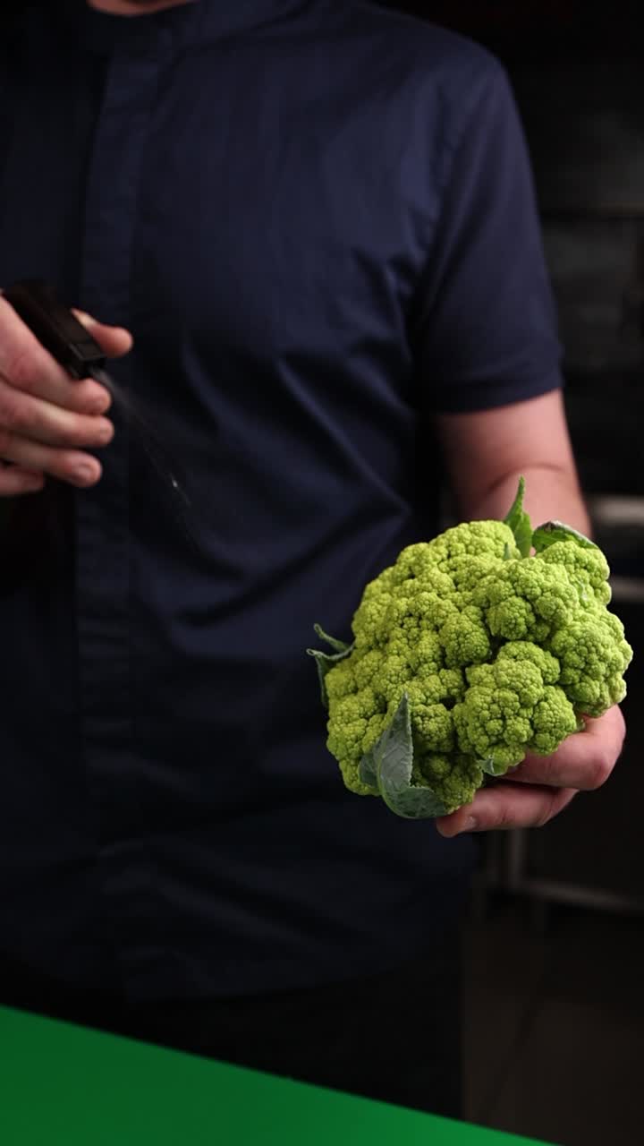Chef preparing green cauliflower