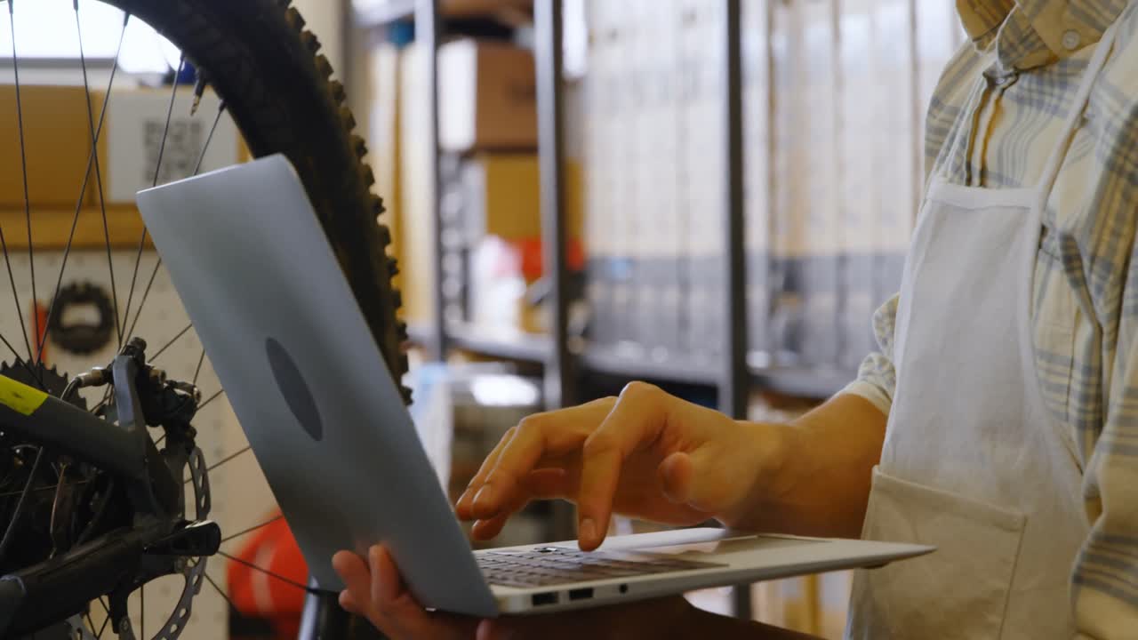 Man using digital tablet in workshop 4k