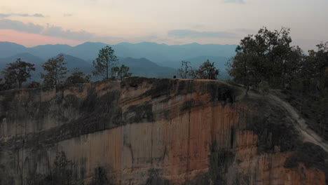 Flying-over-a-cliff-to-reveal-the-beauty-of-Thailand-at-sunrise