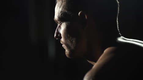 man catching a breath after workout,sweating,face closeup