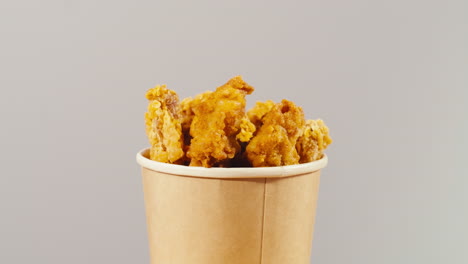 crispy fried chicken in a paper cup