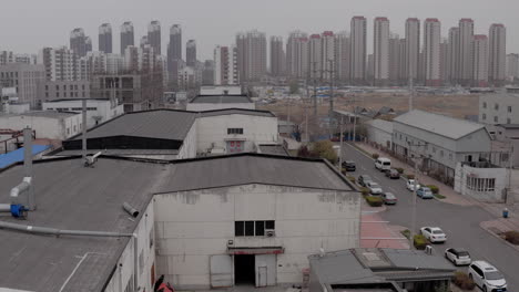 factories surrounded by residential buildings in tianjin, china