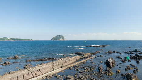 distant view of uninhabited island of seopseom in jeju-do, south korea