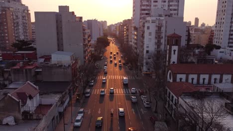 aerial view showing traffic on large avenue road in buenos aires during golden light of sunset,argentina