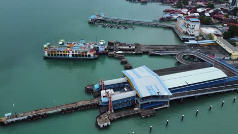 Penang-Ferry-station-sitting-on-the-city-coast-with-vessels-boarding