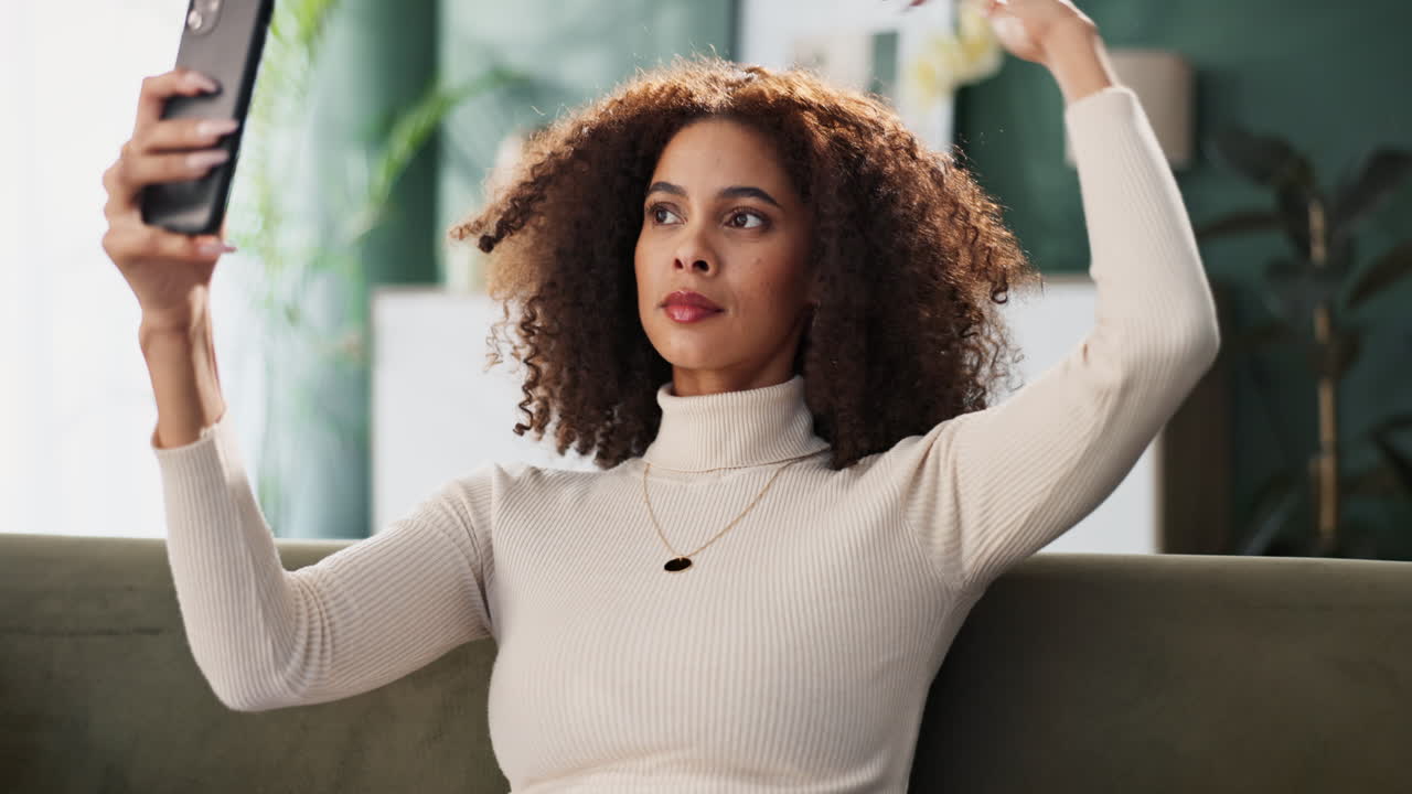 Woman taking a selfie with curly hair