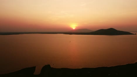 Majestic-Mountains-and-Calm-Waters-Aerial-Perspective-of-Nature's-Beauty-at-Sunset