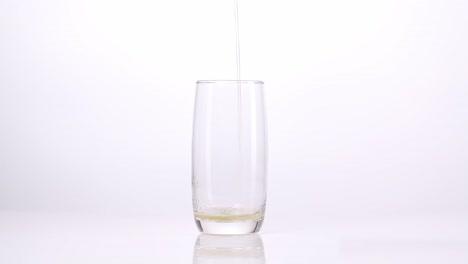 pouring a drink into a glass