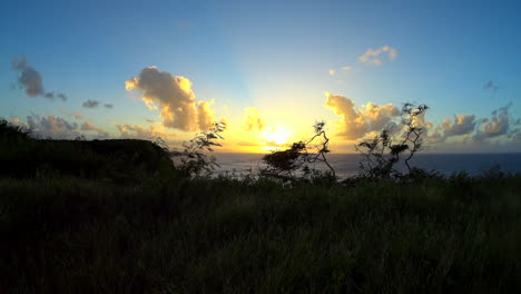 timelapse from a cliff top of a breathtakingly beautiful sunset over the caribbean sea