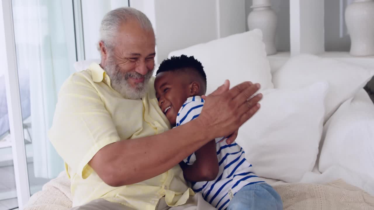 Mature man enjoying time with his grandson