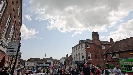 vintage cars displayed on bustling street in arundel