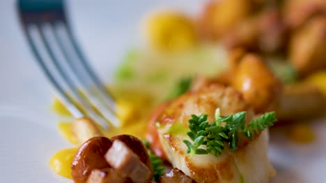 a gourmet seafood scallop dish is delicately eaten with a fork in a fine dining setting, captured in a shallow depth-of-field close-up with natural lighting
