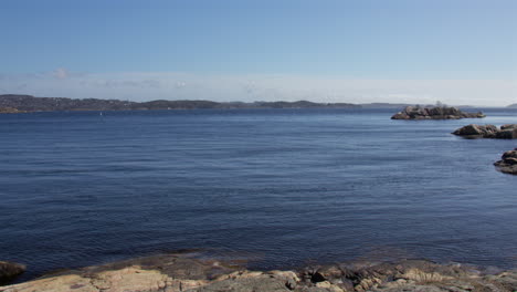 extra wide shot of a calm inland sea and rocks at odderøya in kristiansand