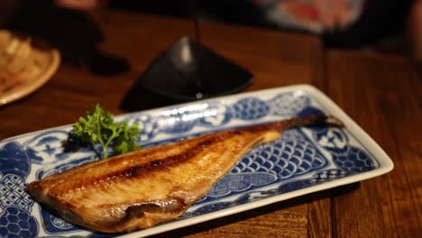 delicious grilled fish served on a decorative plate