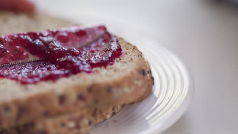 Jelly-is-spread-across-bread